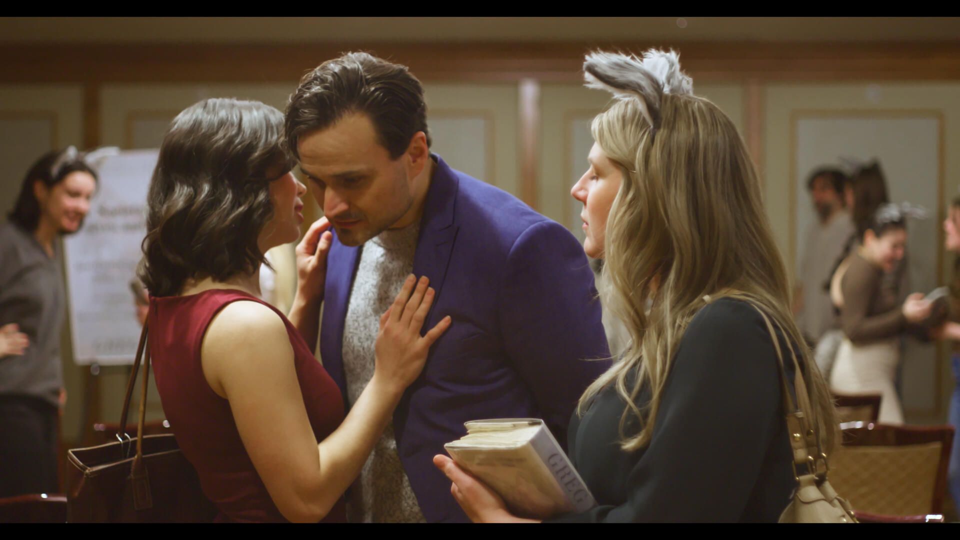 Method & Madness Still 1 The protagonist of Method & Madness watches the antagonist and a teammate speaking discreetly.